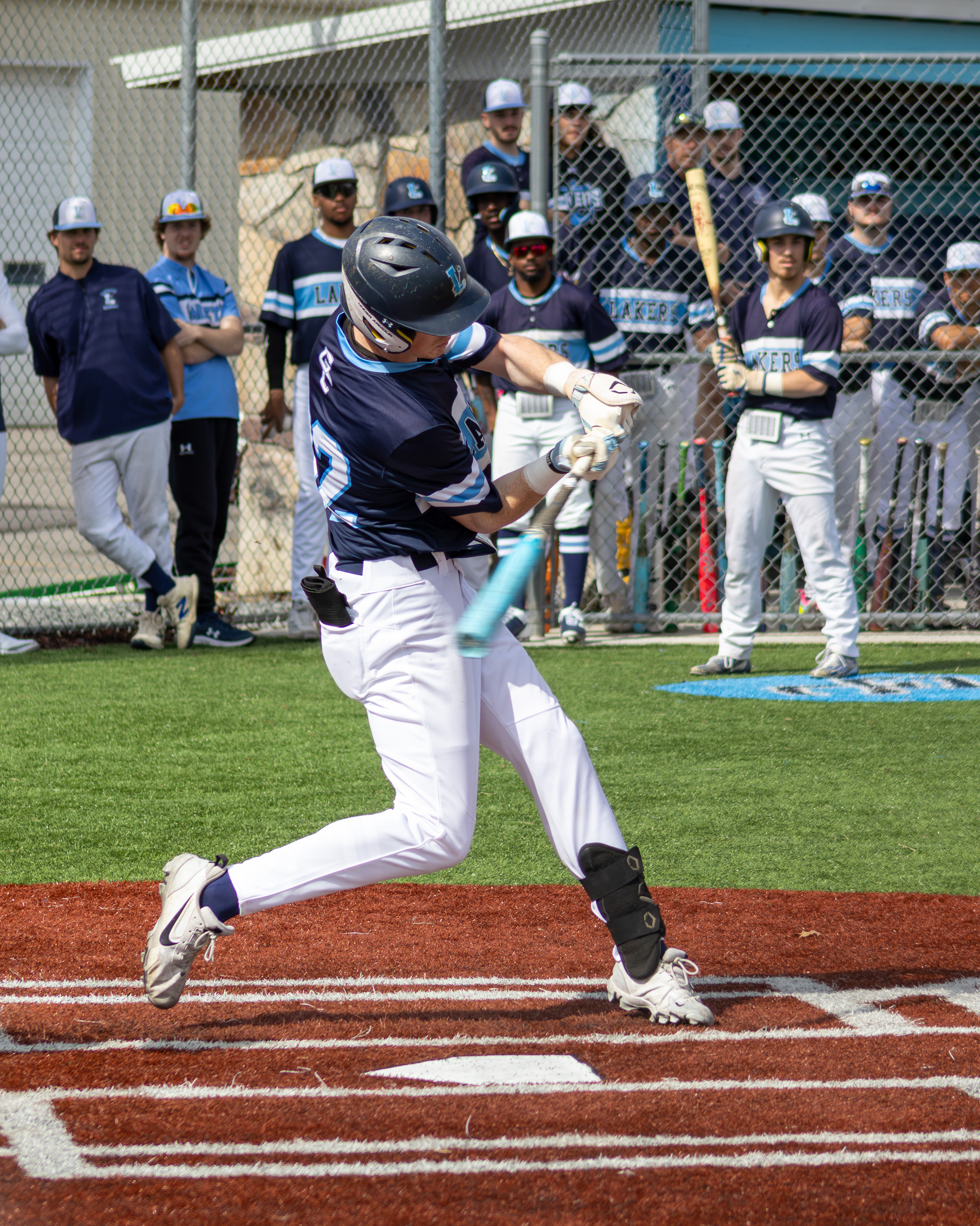 JJ Charlton makes contact, image captioned below.